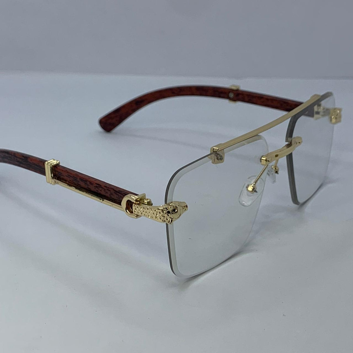 Cartier Auto-Tint Gold & Wooden Frame Sunglasses | Photochromic Rimless Shield Design